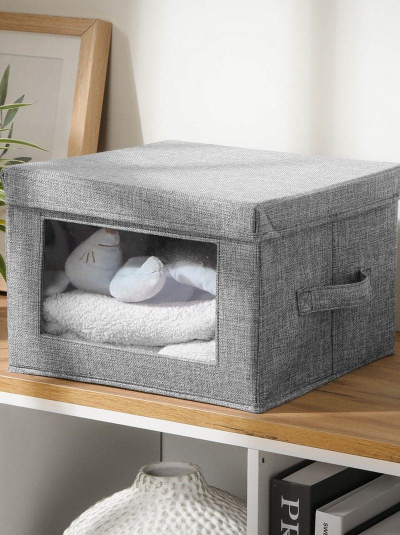 un coffre de rangement pliable en tissu gris